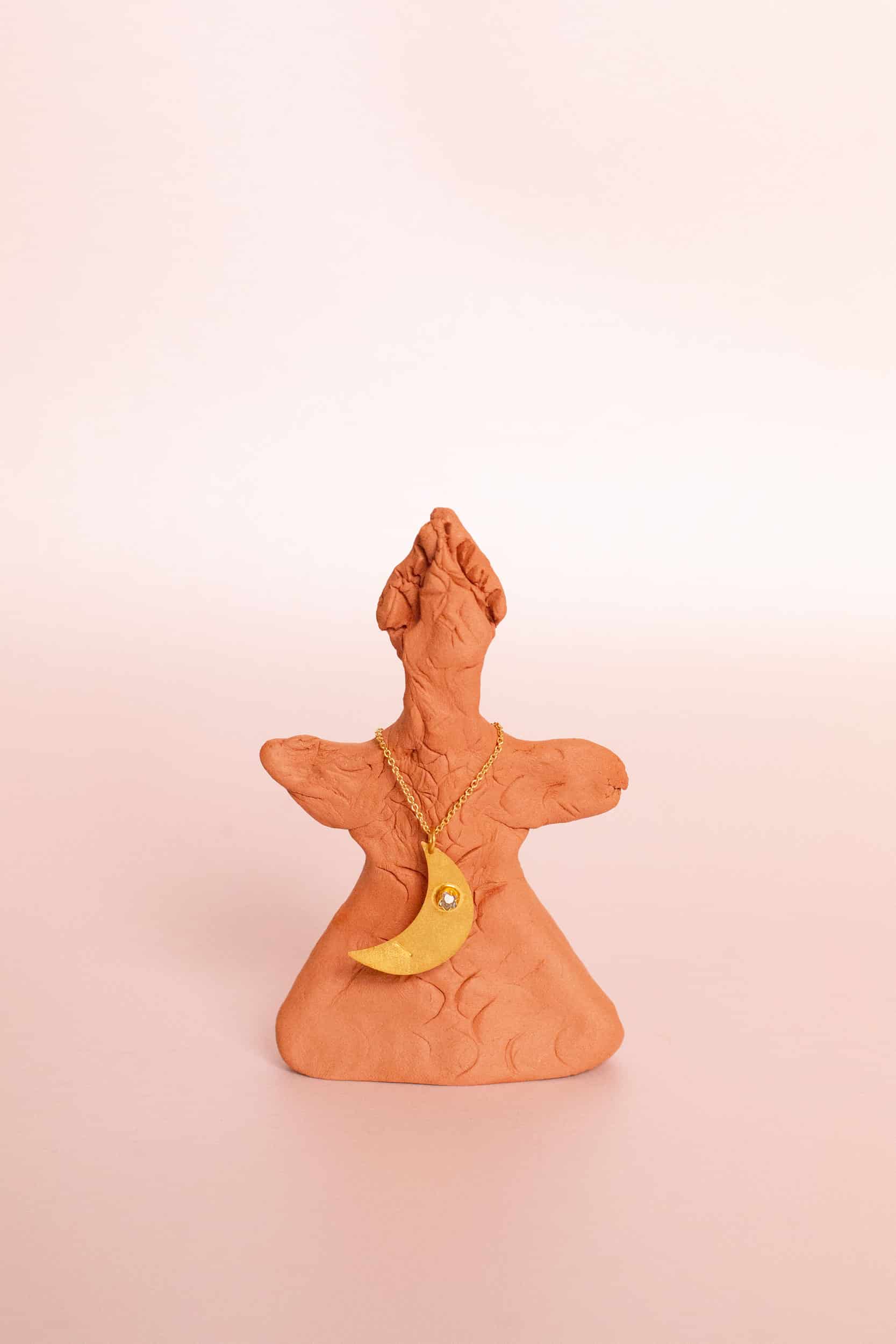 Aku gold pendant