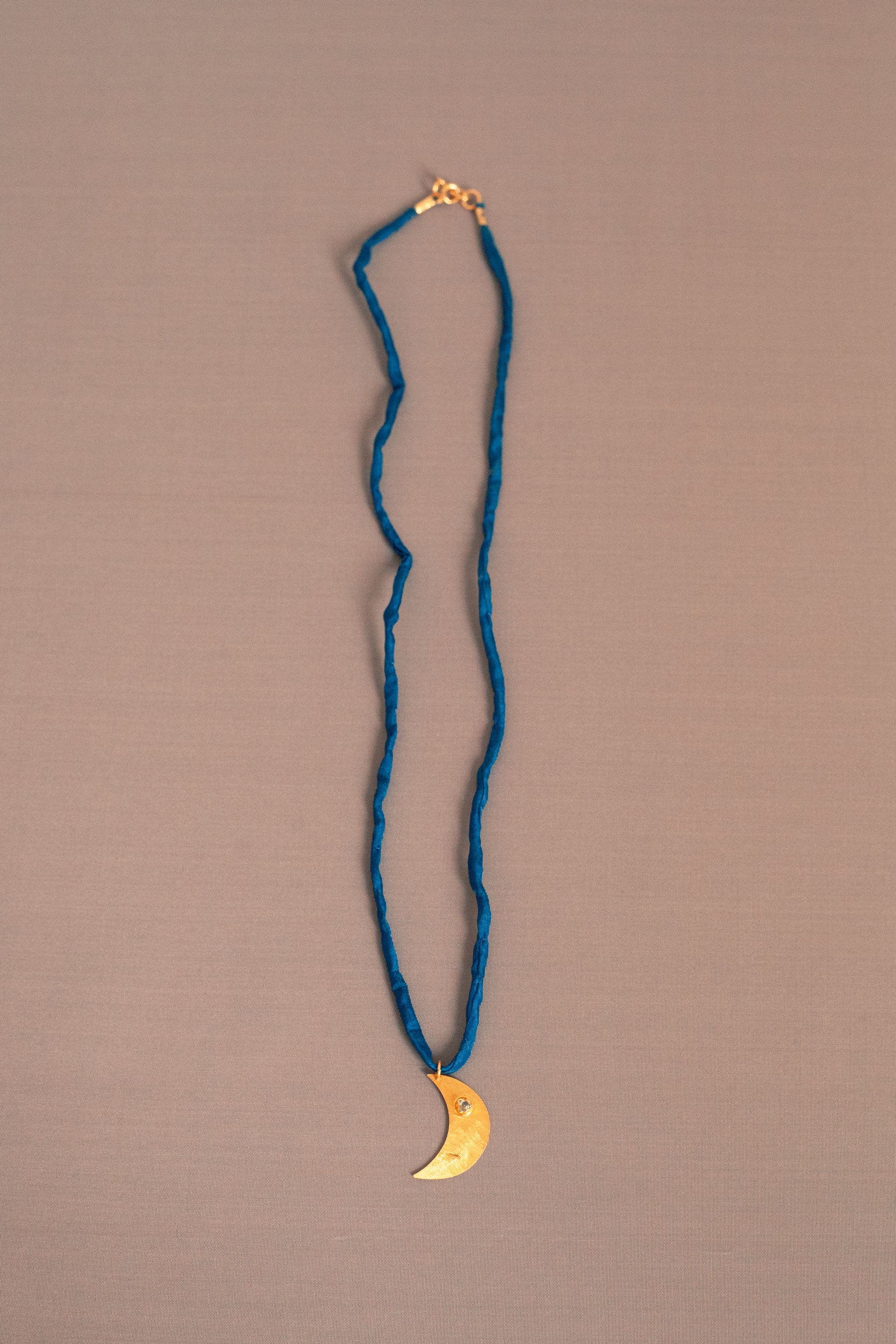 Aku gold silk necklace