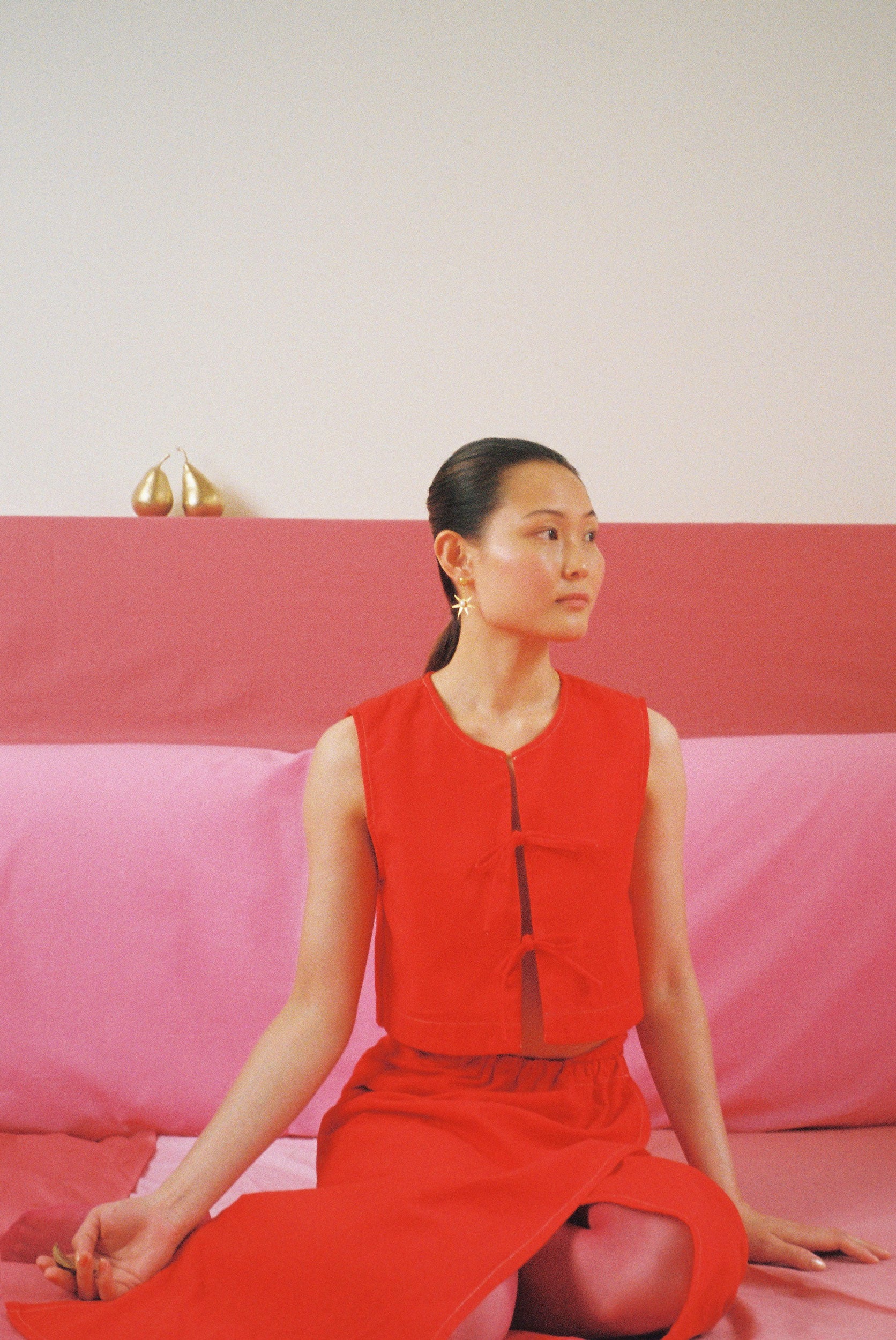 Red dyed top with bows