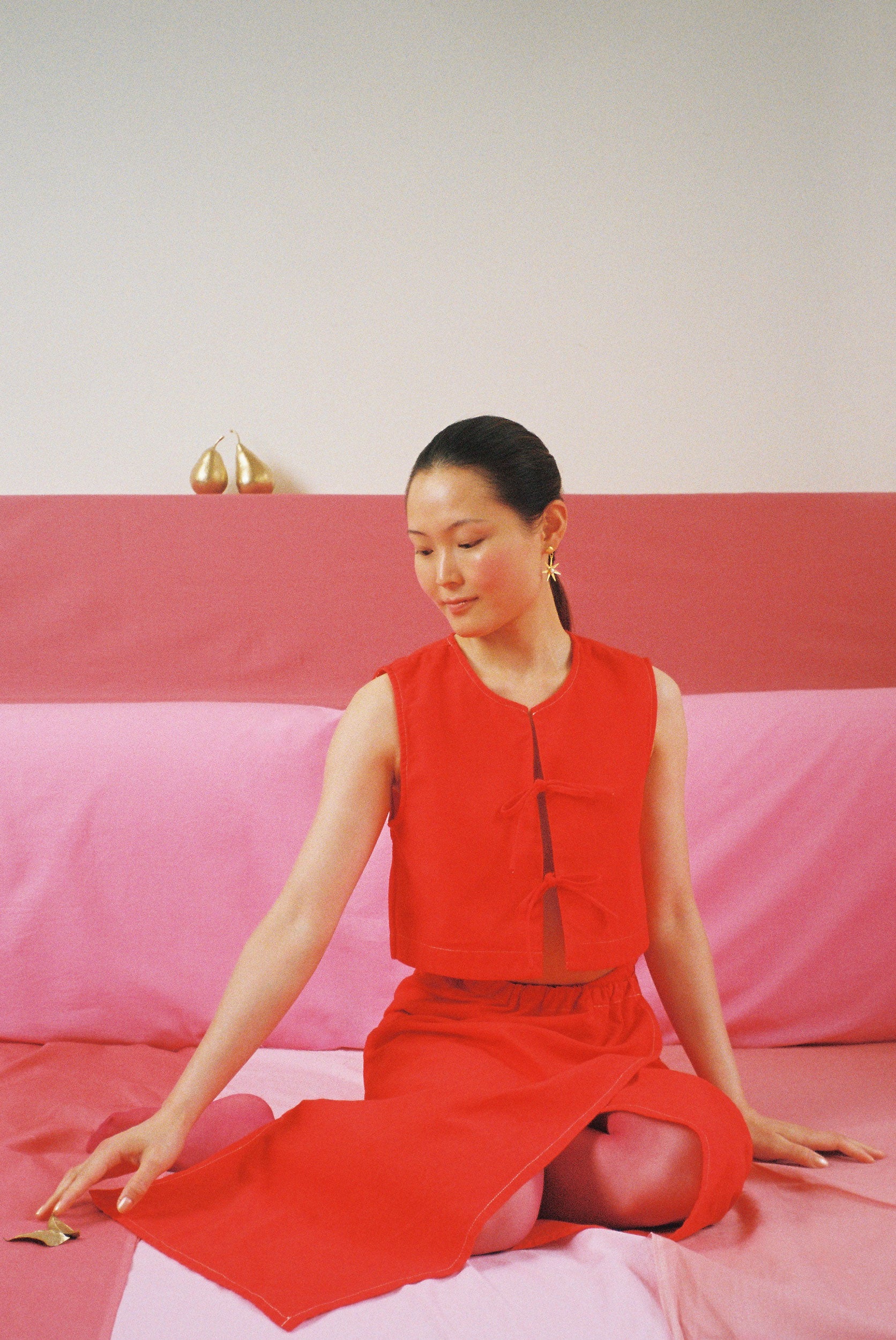 Red dyed top with bows