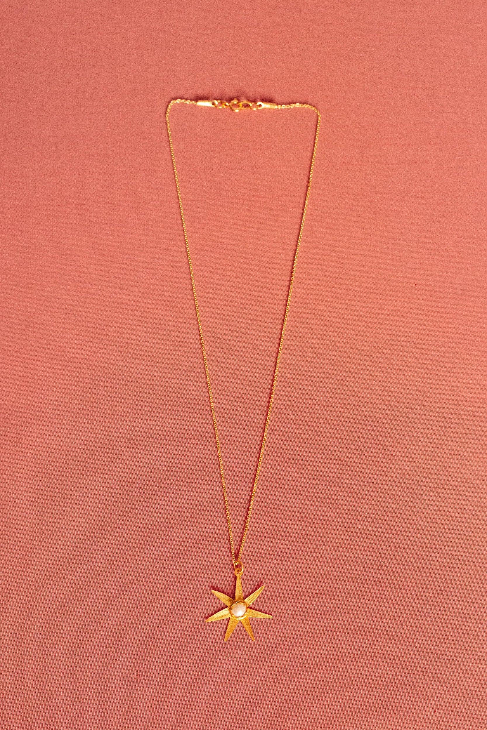 Atlas gold pendant