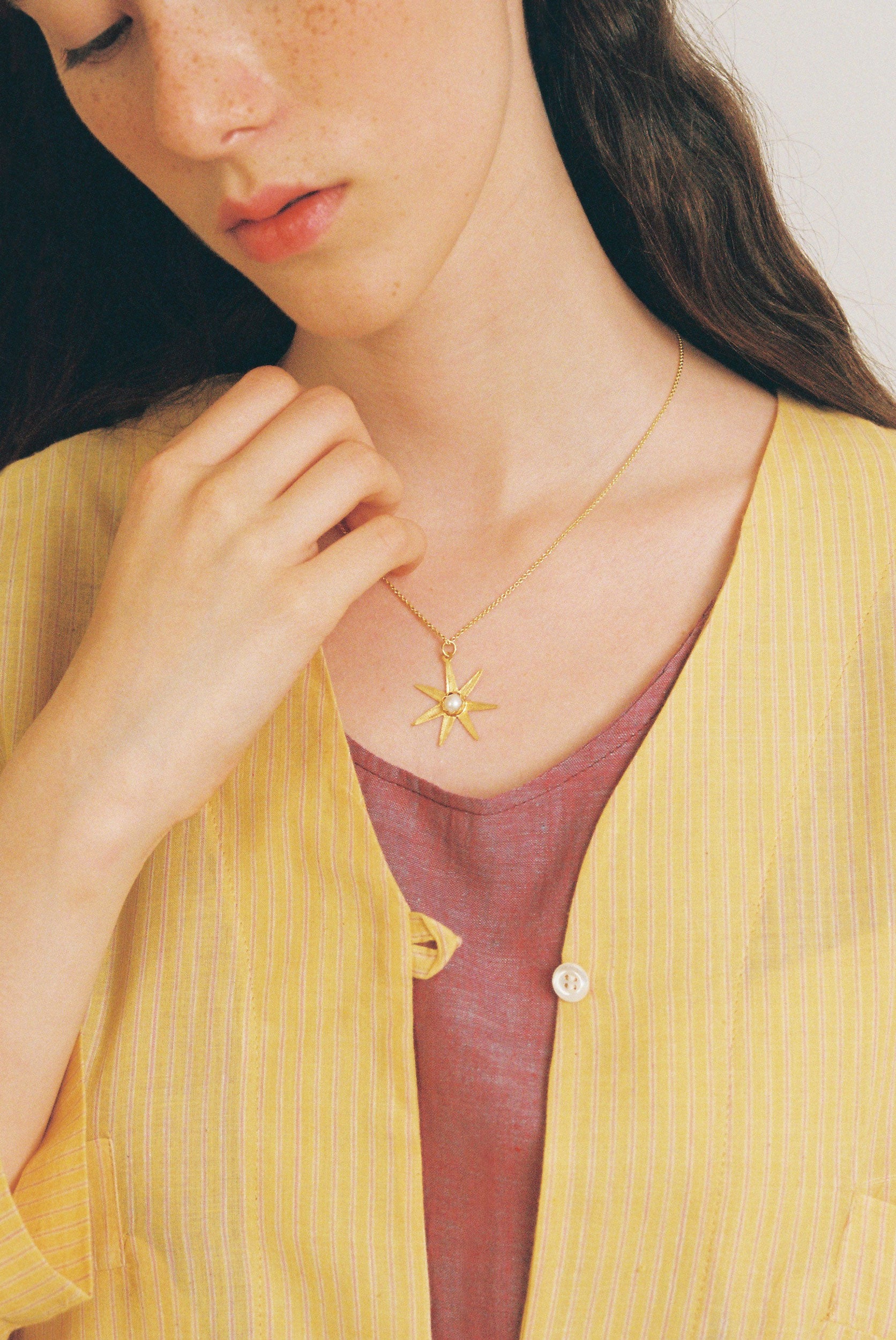 Atlas gold pendant