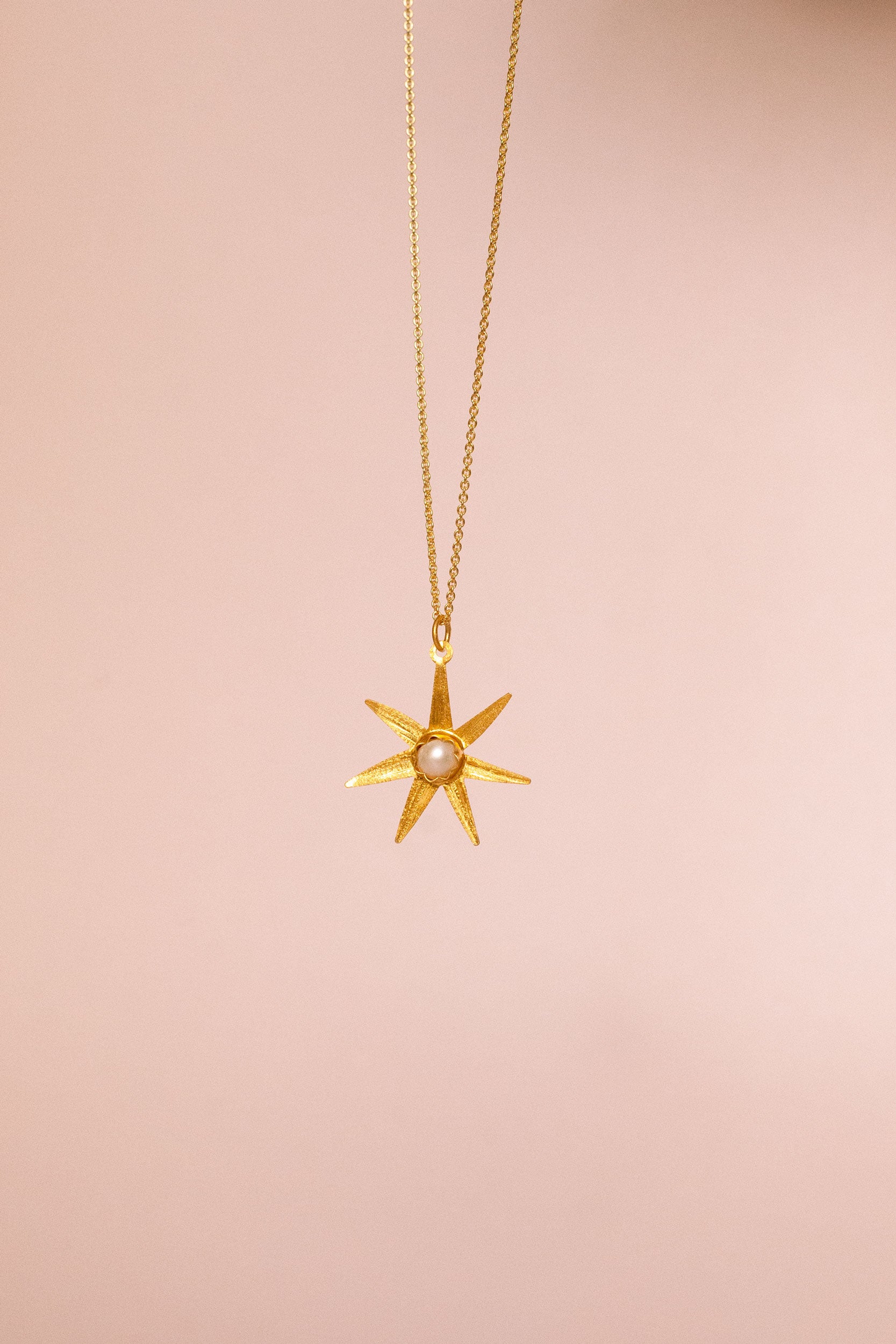 Atlas gold pendant