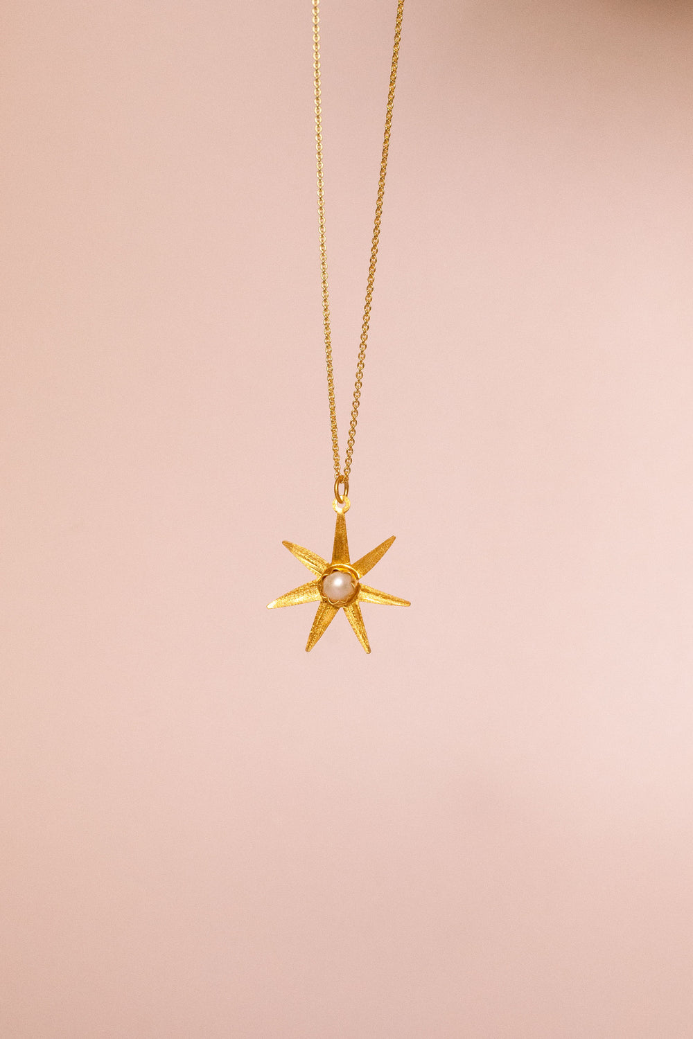 Atlas gold pendant