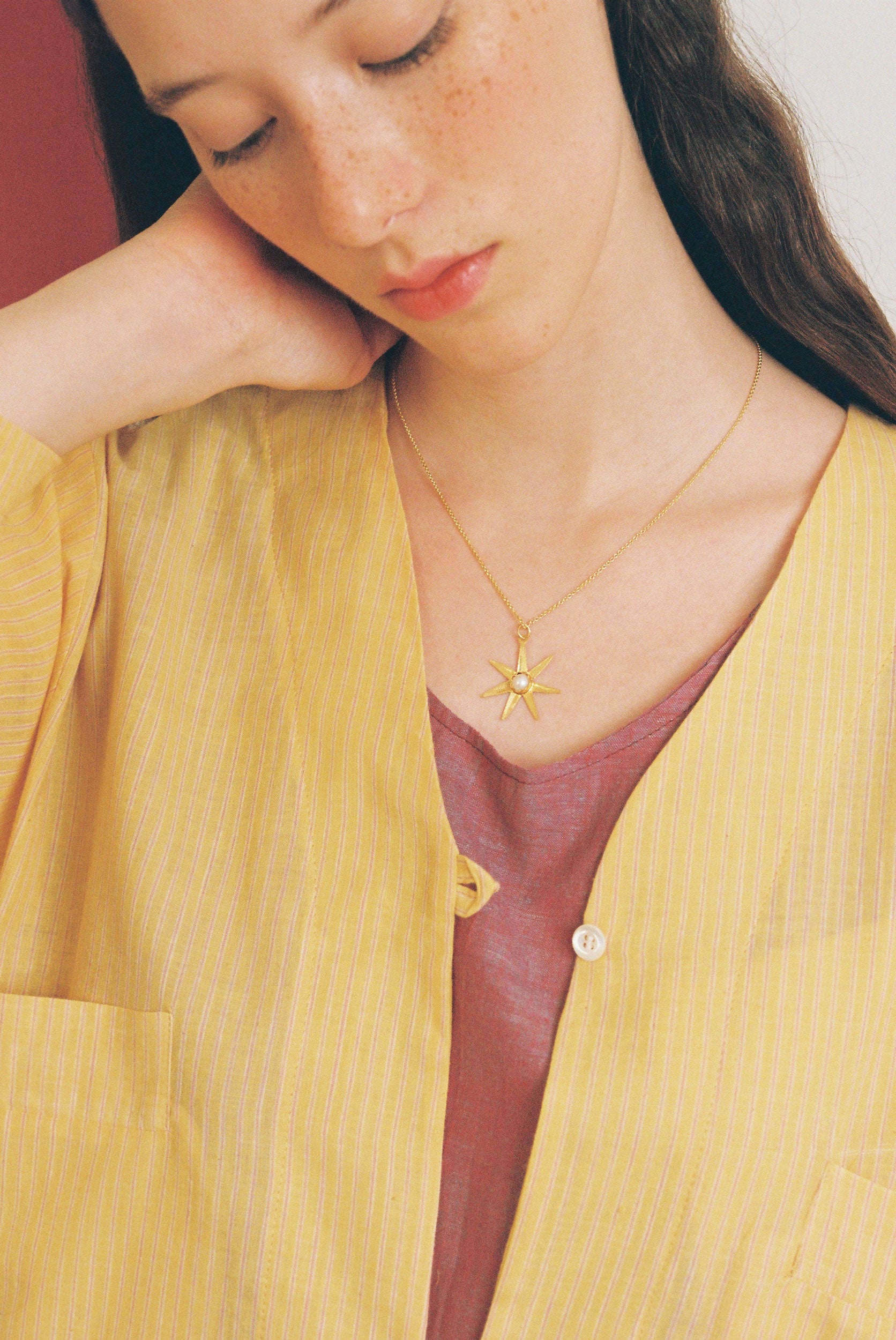 Atlas gold pendant