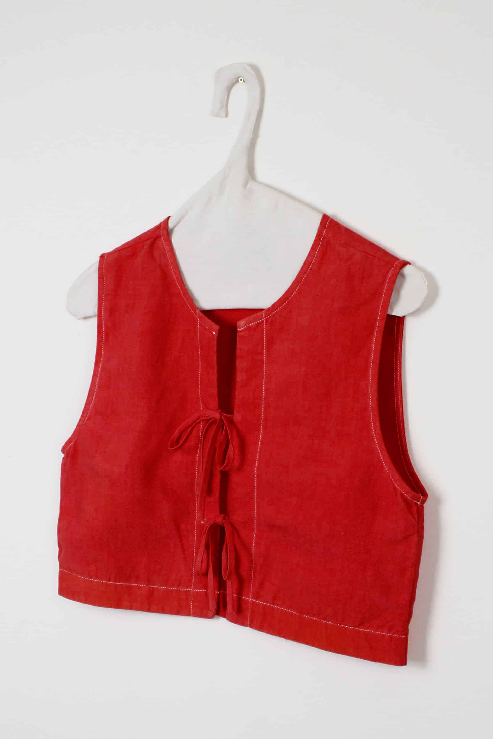 Red dyed top with bows