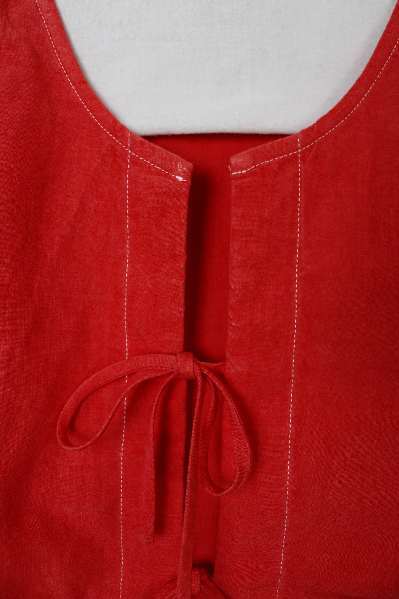 Red dyed top with bows