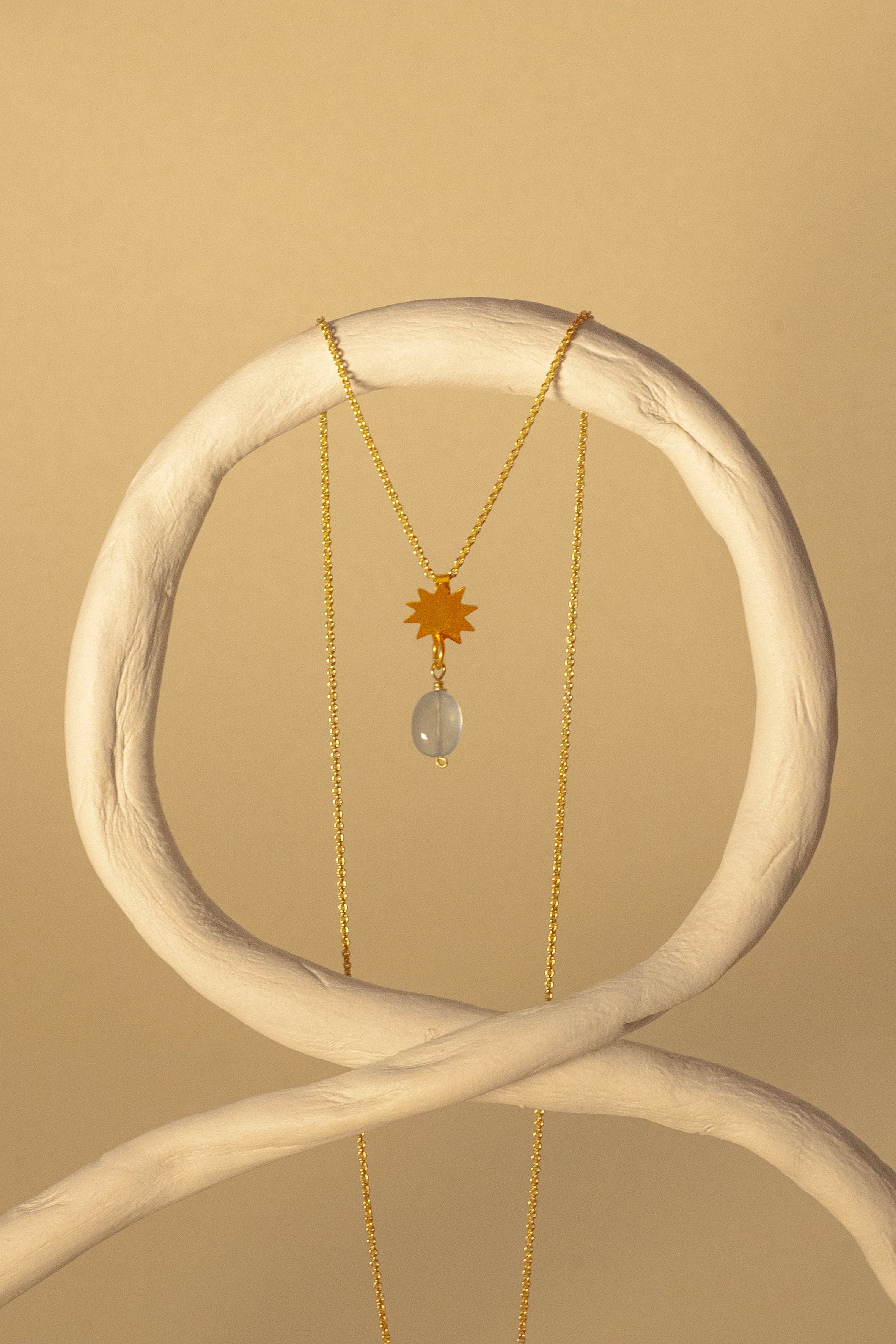 Vela gold pendant