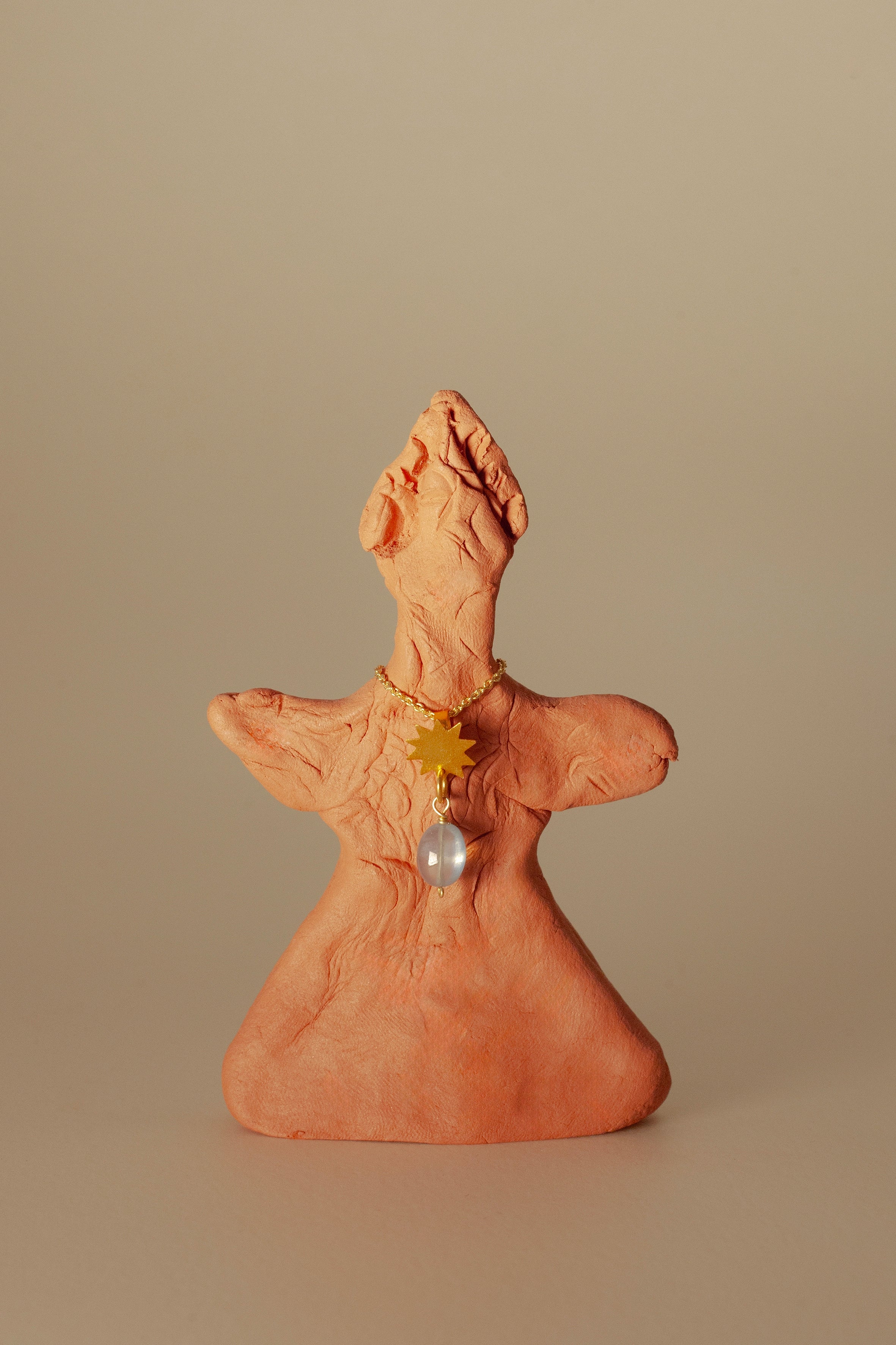 Vela gold pendant