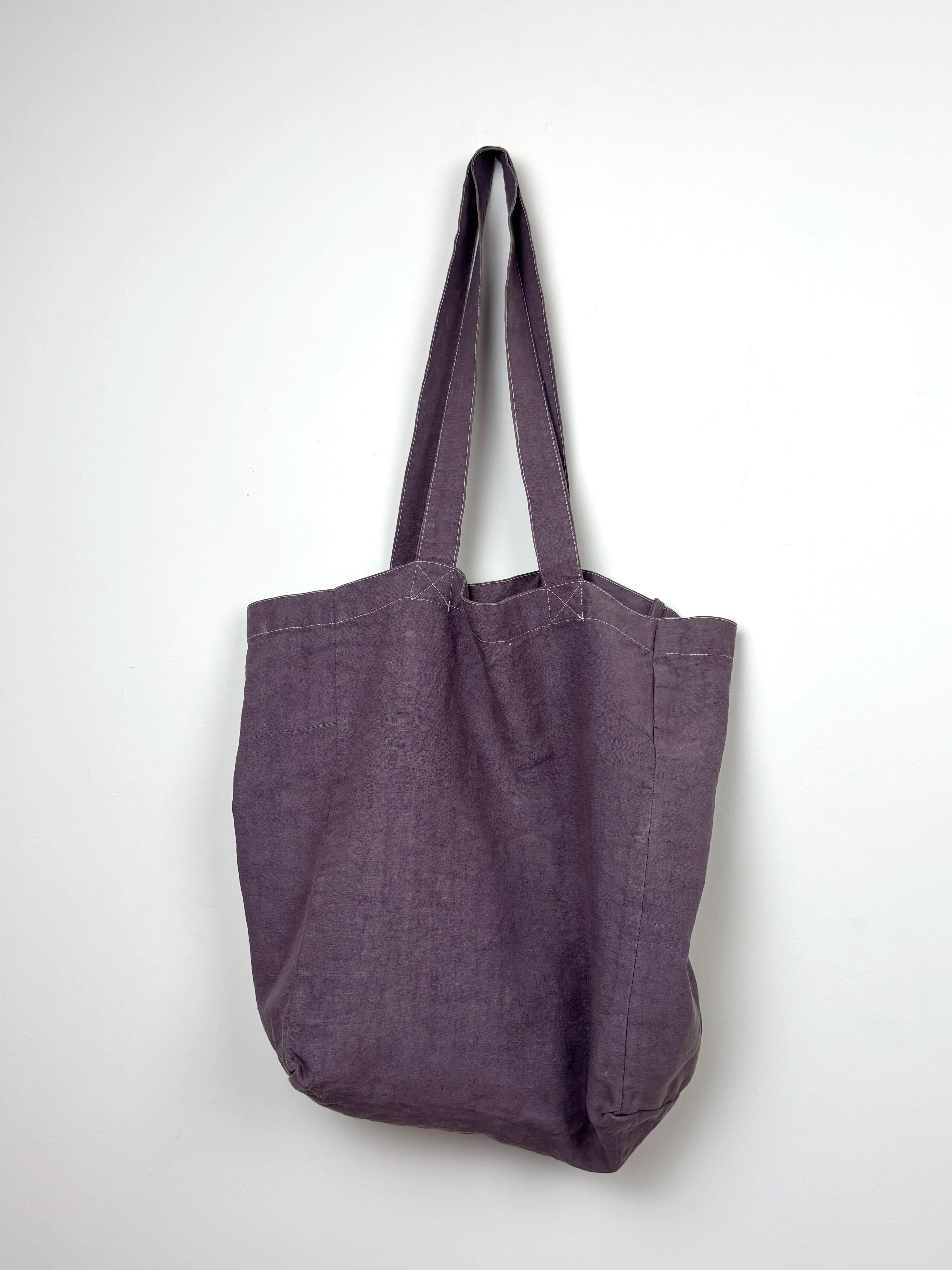 Yellow horse in a lilac dyed bag