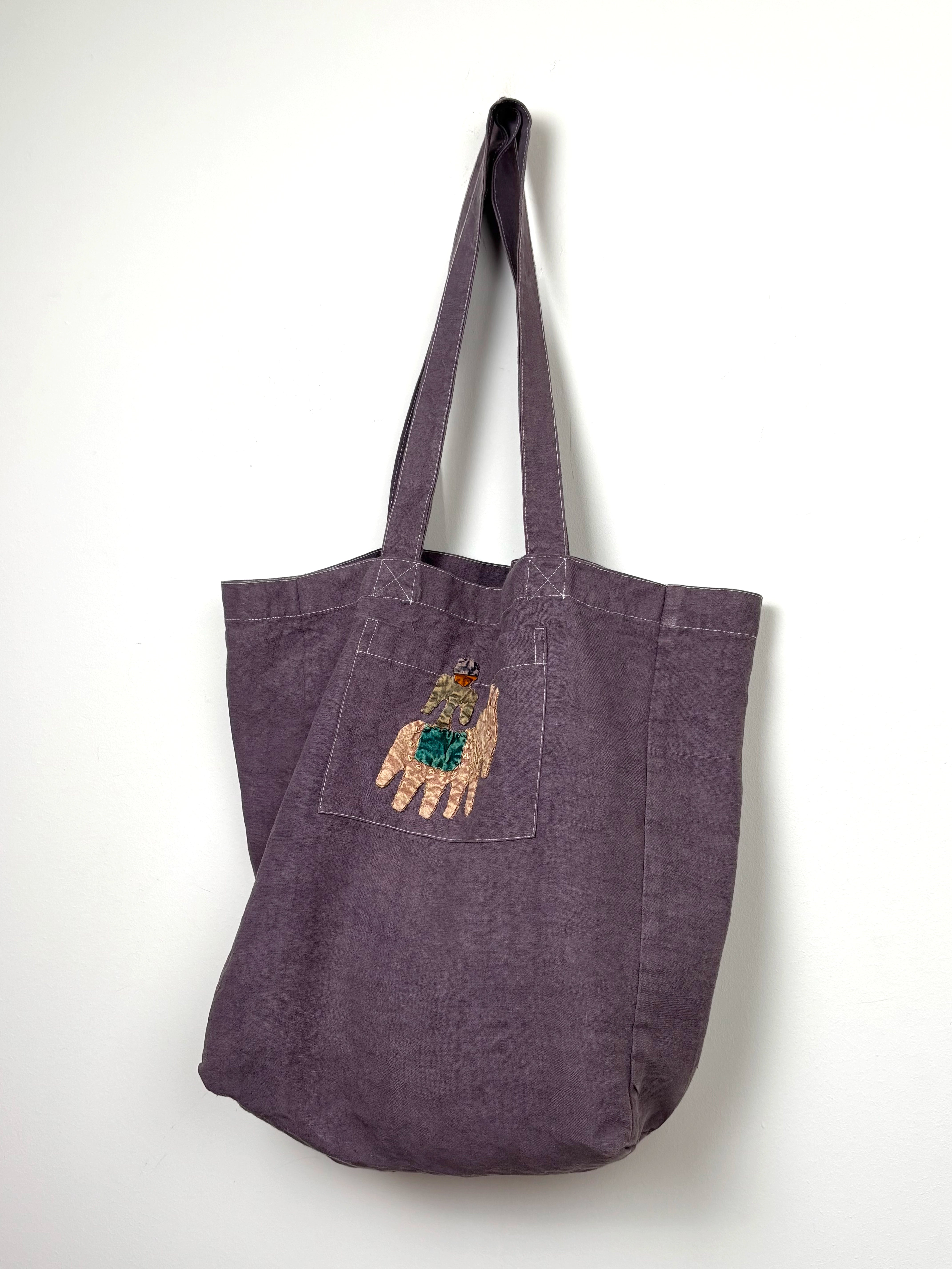 Yellow horse in a lilac dyed bag