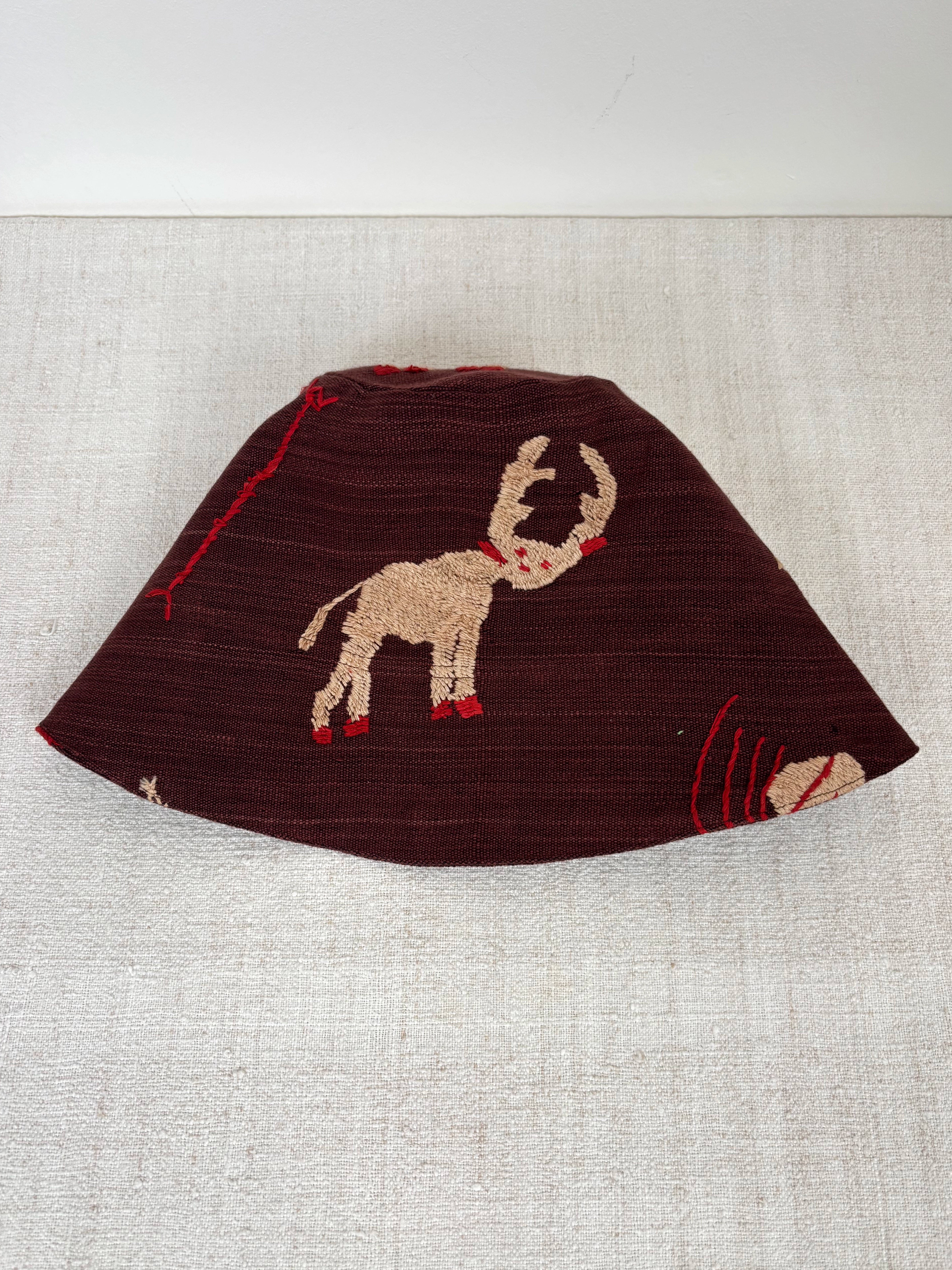 White reindeer scene hat
