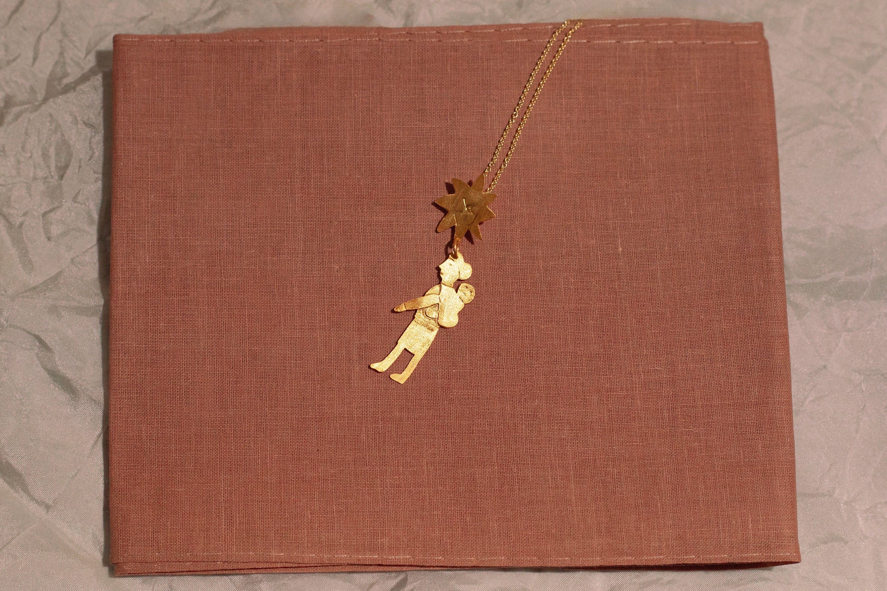 Mater gold pendant
