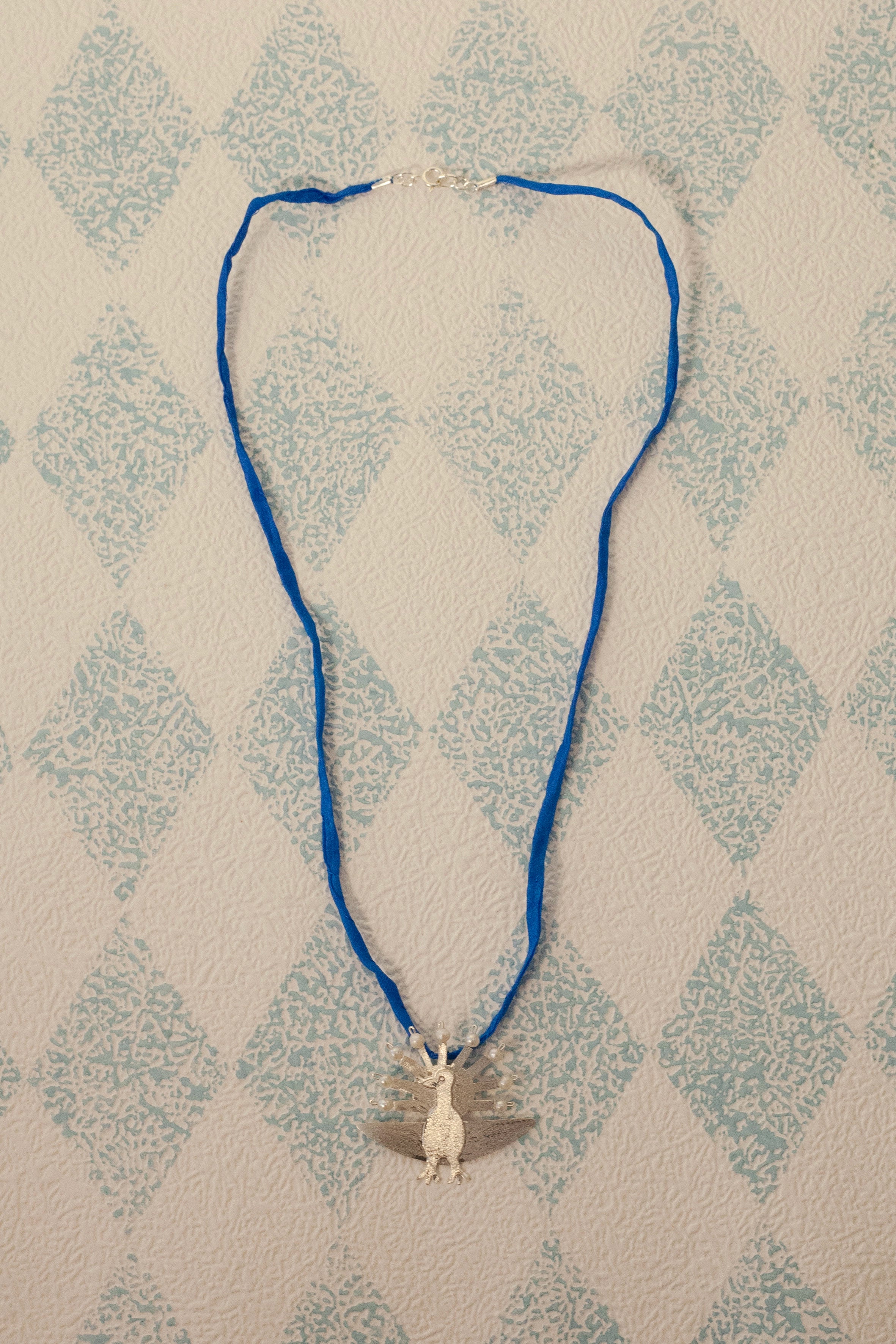 Ocelo silver silk necklace