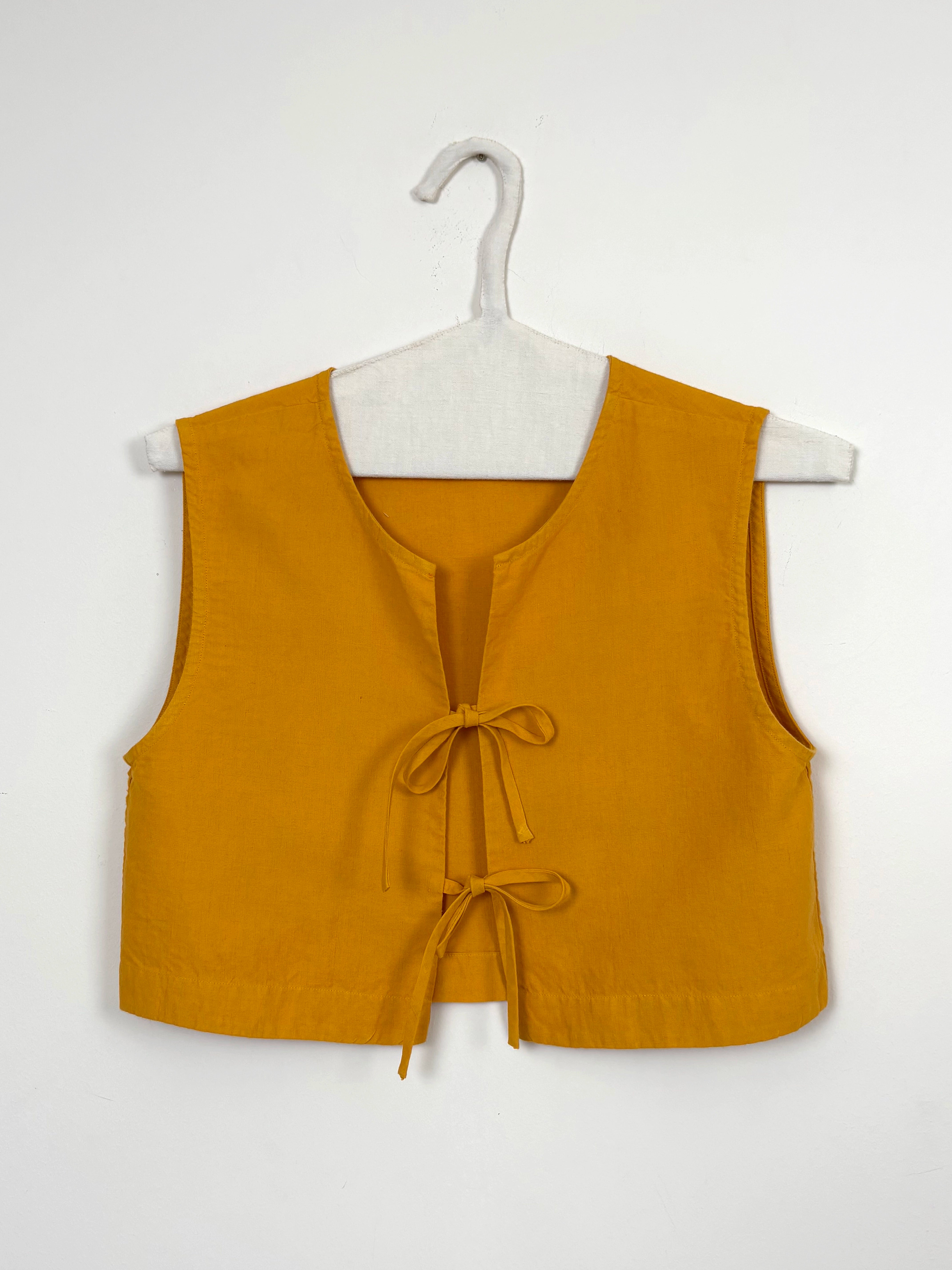 Vibrant yellow dyed top with bows