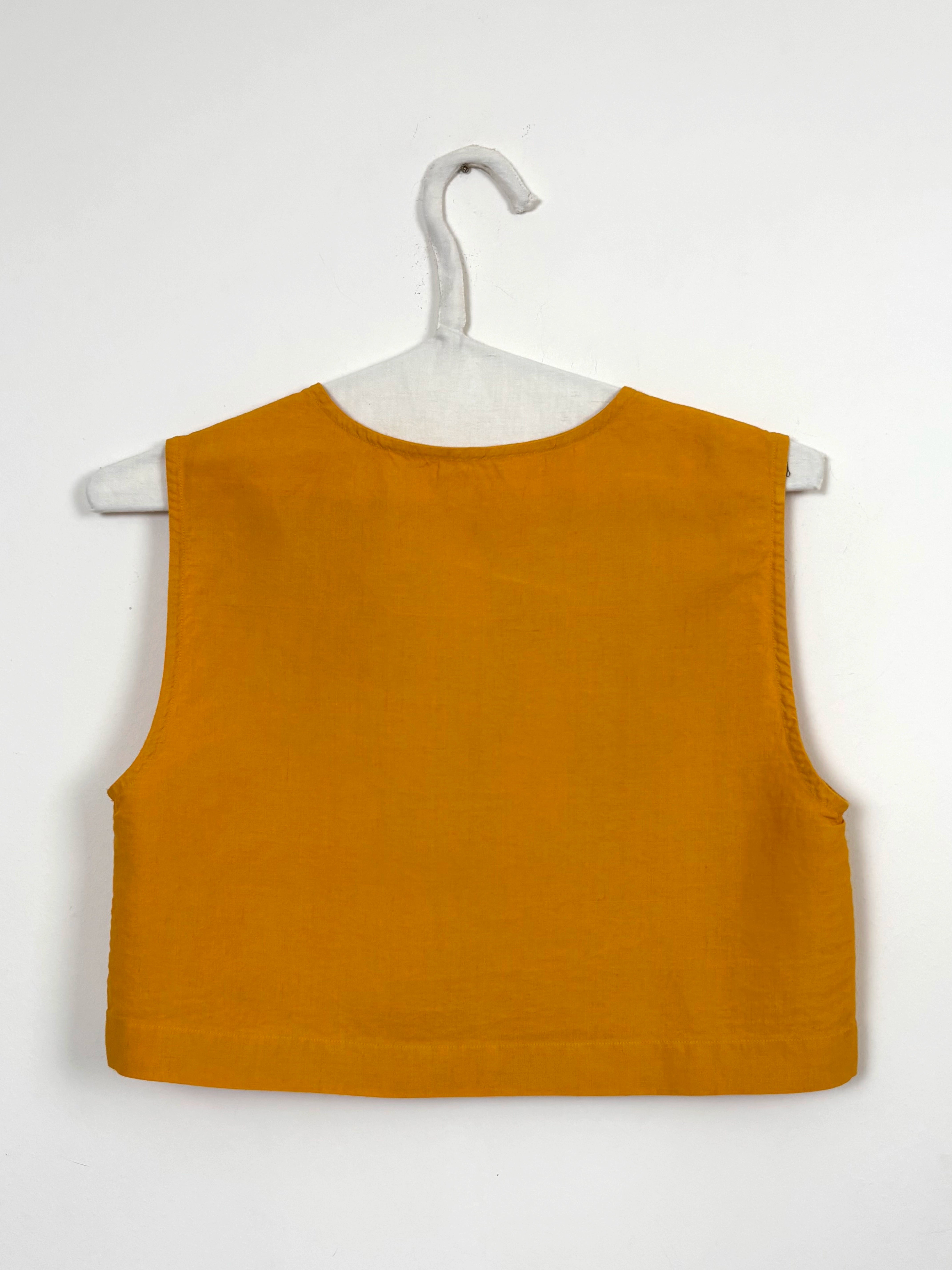 Vibrant yellow dyed top with bows