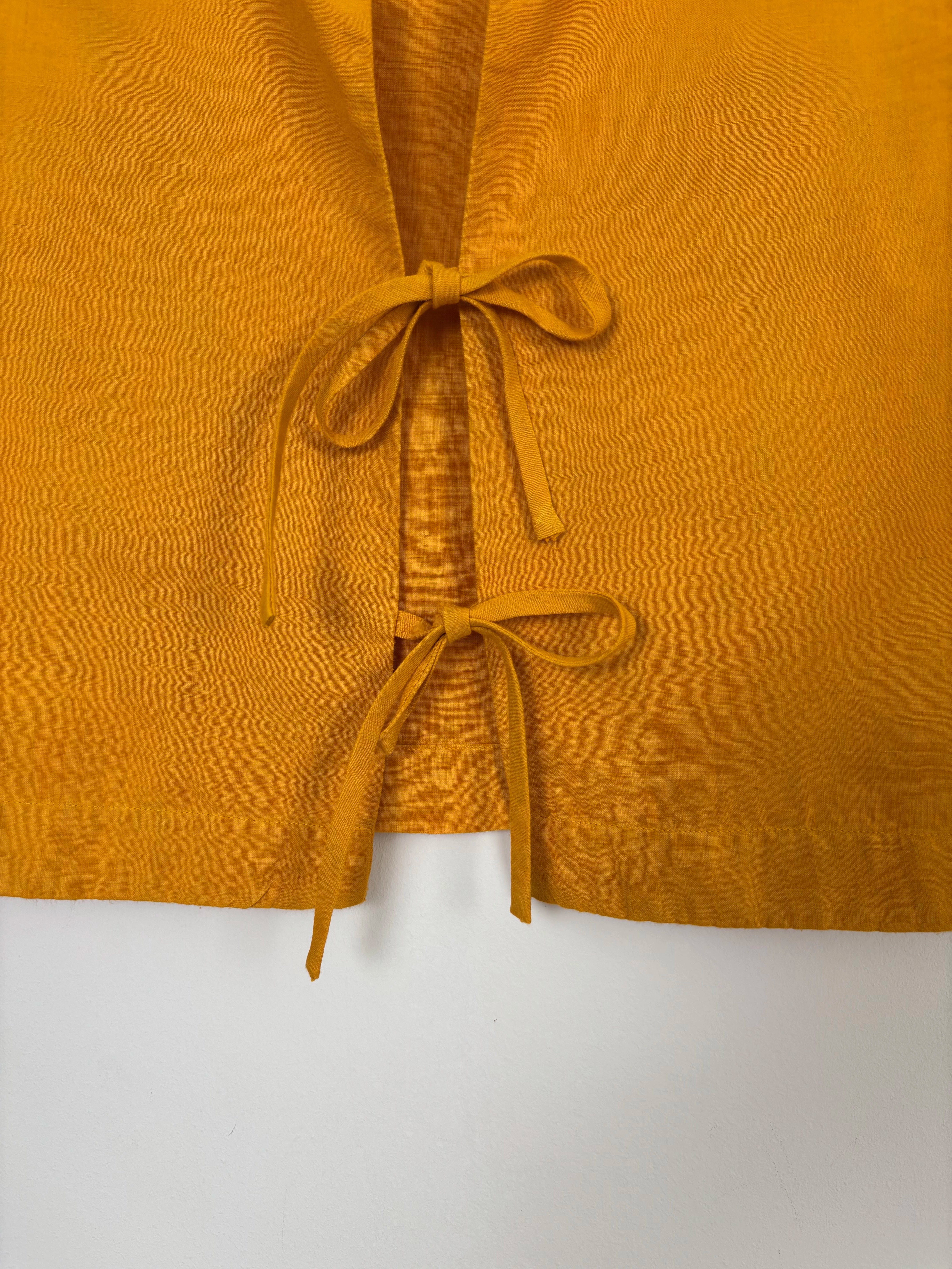 Vibrant yellow dyed top with bows