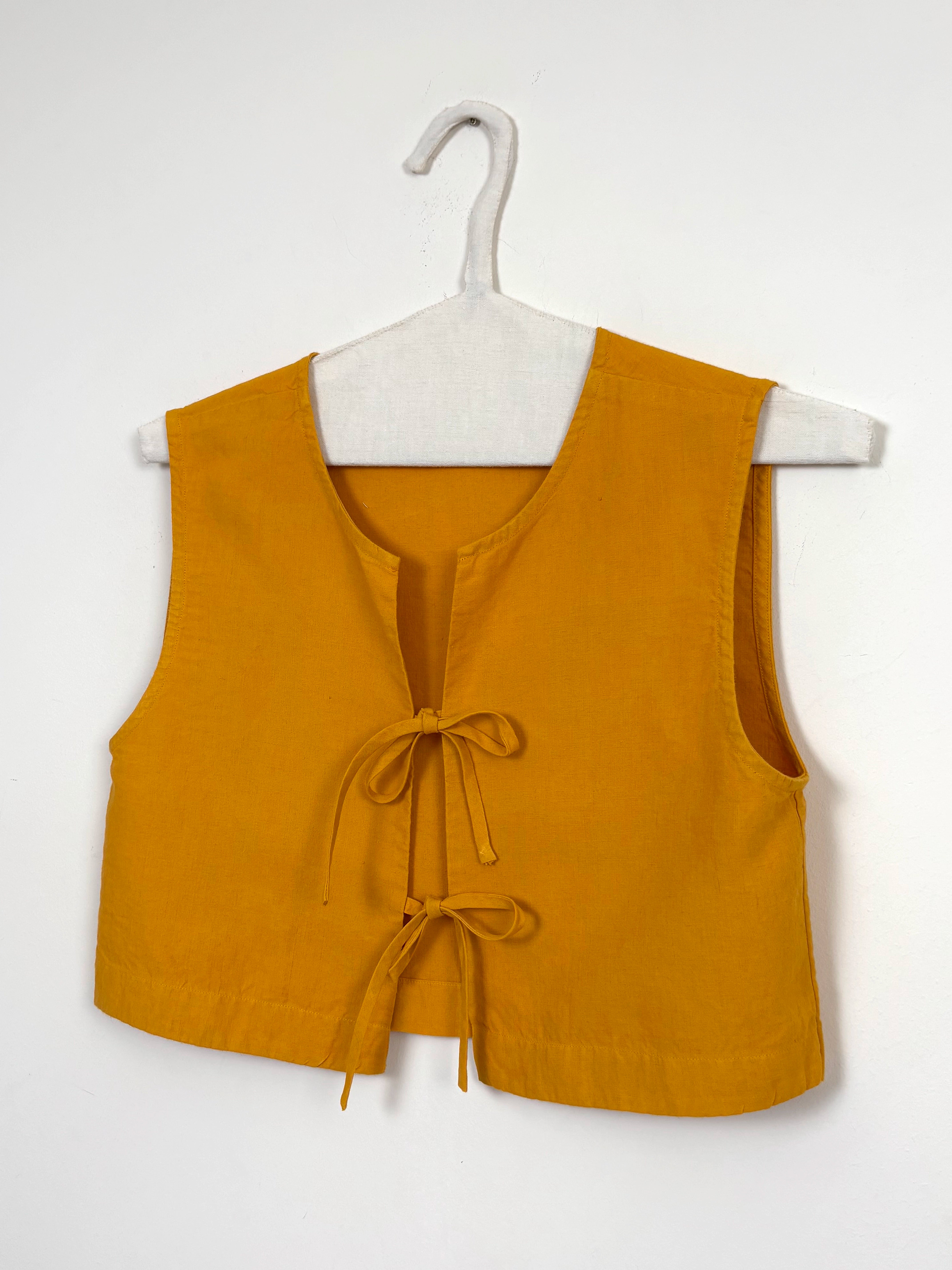 Vibrant yellow dyed top with bows